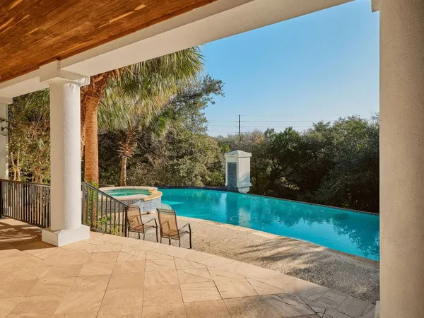 a view of a patio with a yard