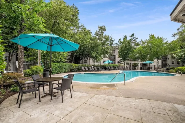 an aerial view of a house with a swimming pool