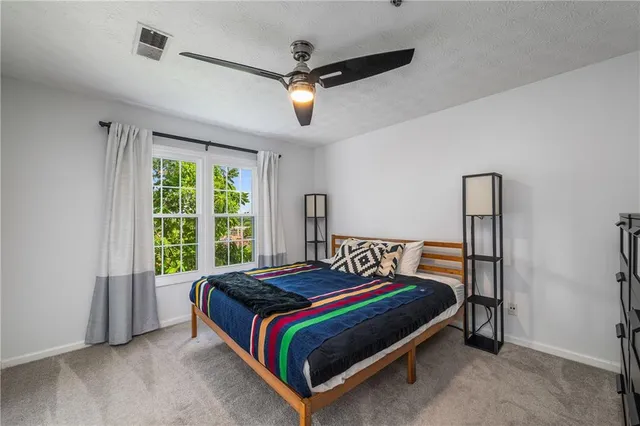 a bedroom with a bed and window