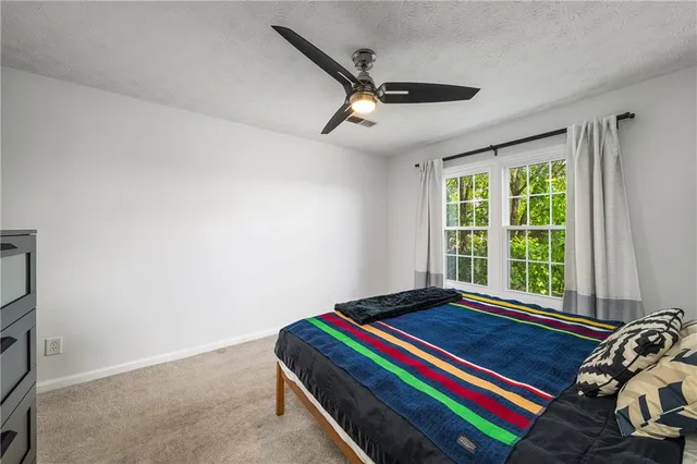 a room with a bed and a window