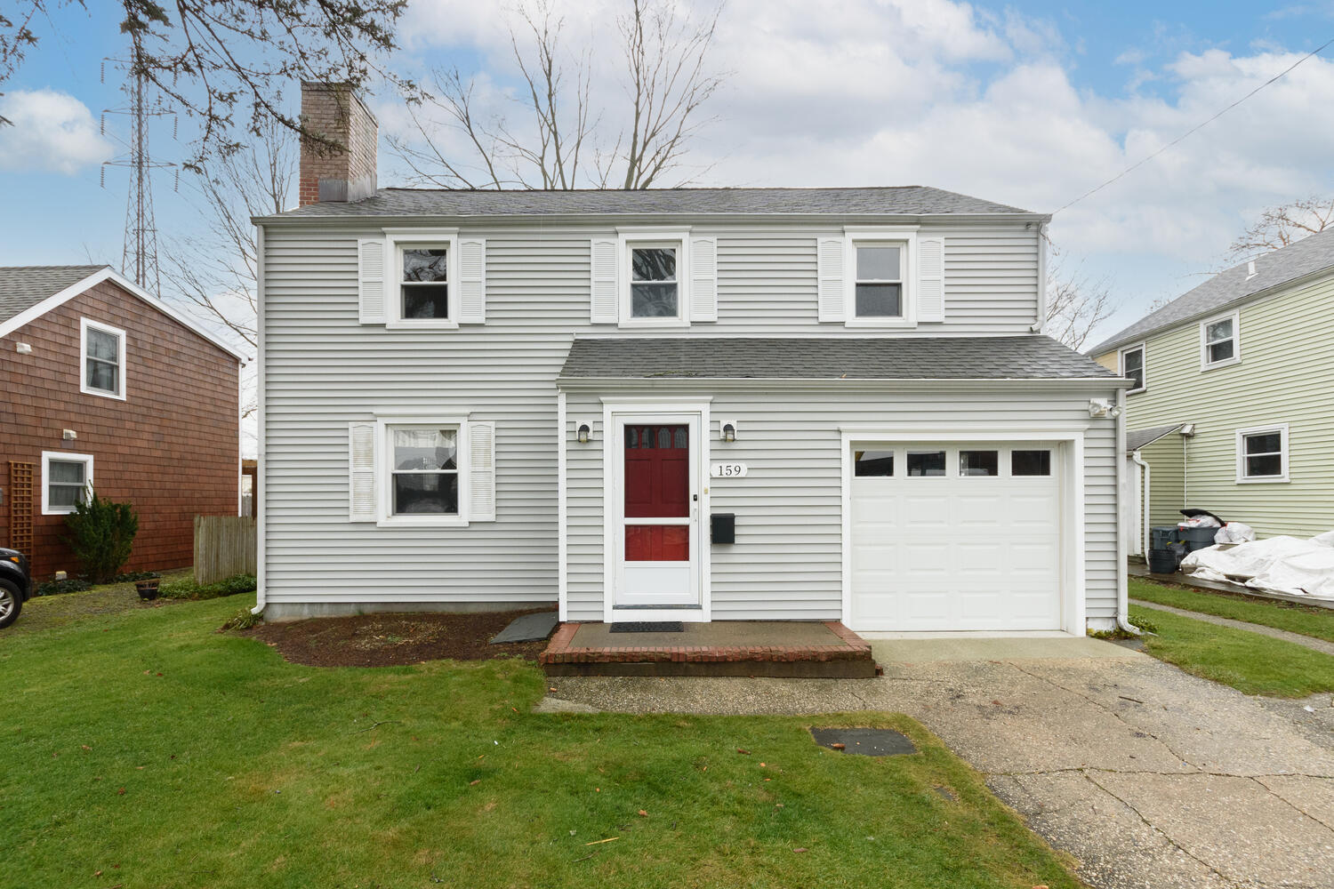 159 Hollow Tree Ridge Road Darien, CT 06820 - Photo 1 of 20 a front view of a house with a yard