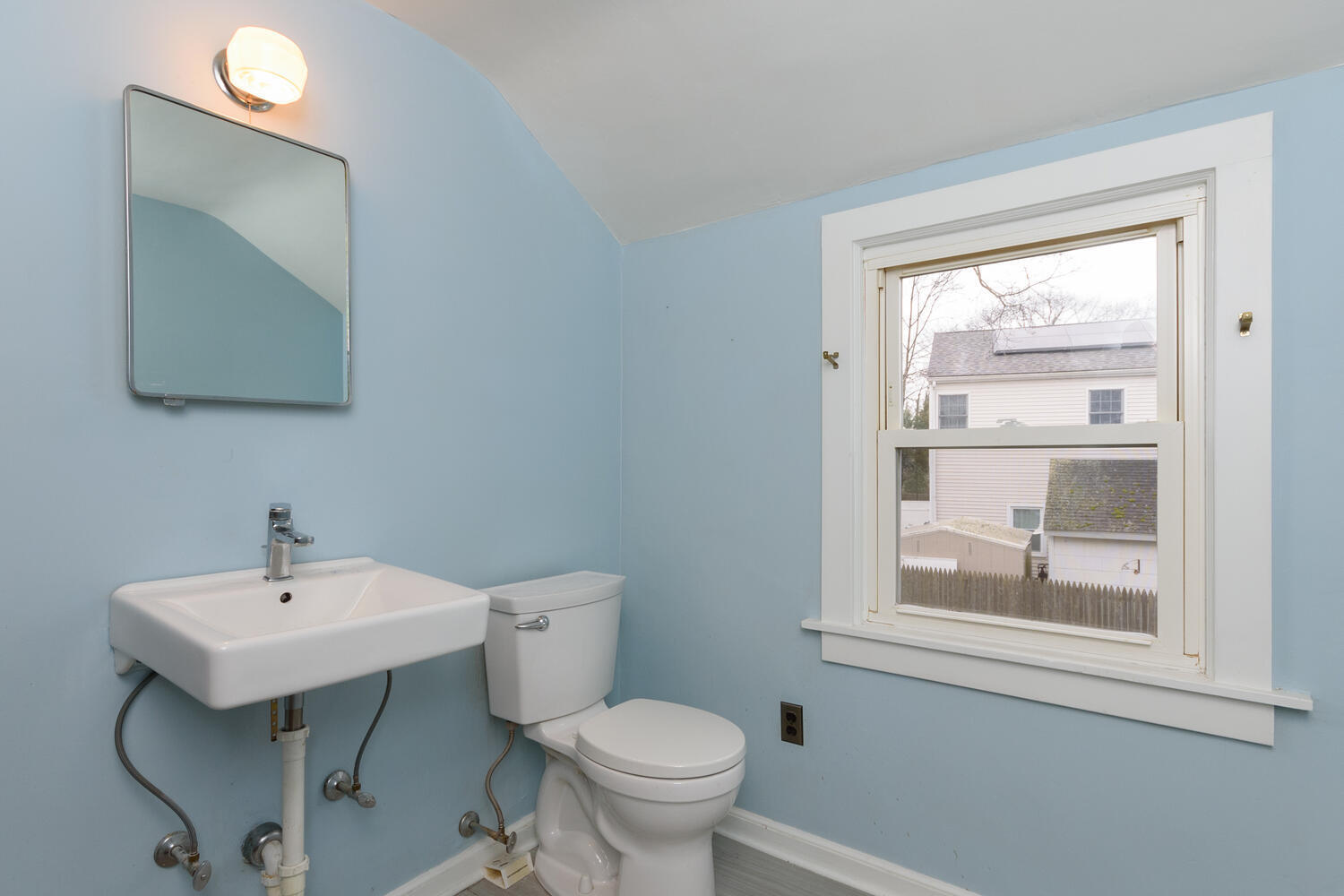 159 Hollow Tree Ridge Road Darien, CT 06820 - Photo 11 of 20 a bathroom with a toilet a sink and a mirror