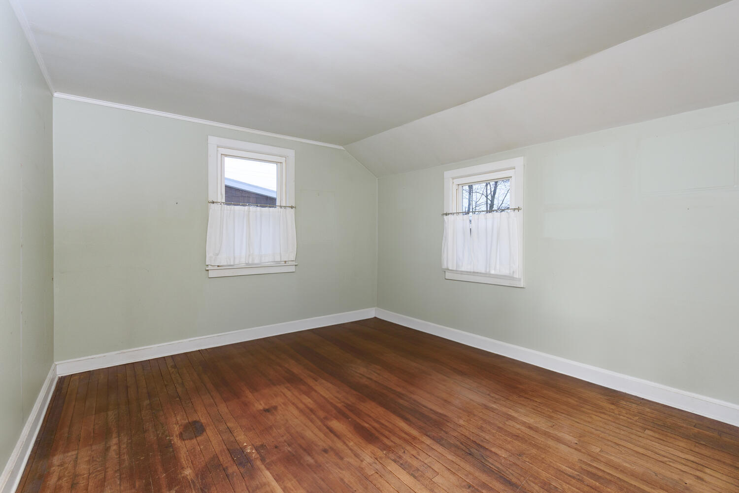 159 Hollow Tree Ridge Road Darien, CT 06820 - Photo 12 of 20 a view of a room with wooden floor and windows
