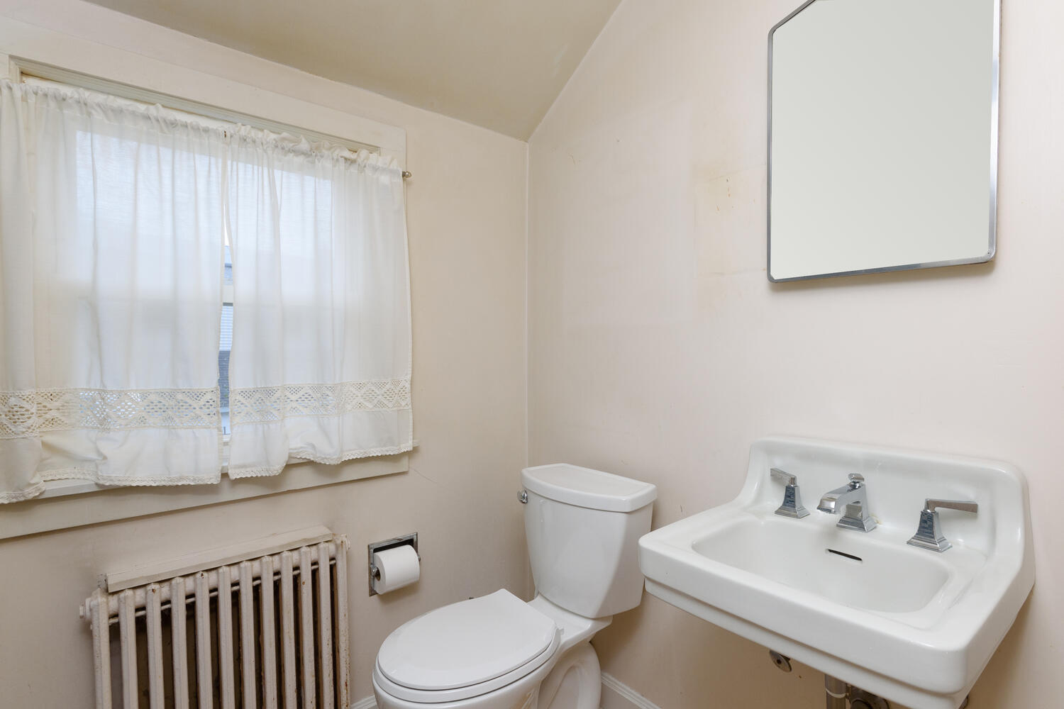 159 Hollow Tree Ridge Road Darien, CT 06820 - Photo 13 of 20 a bathroom with a sink a toilet and mirror