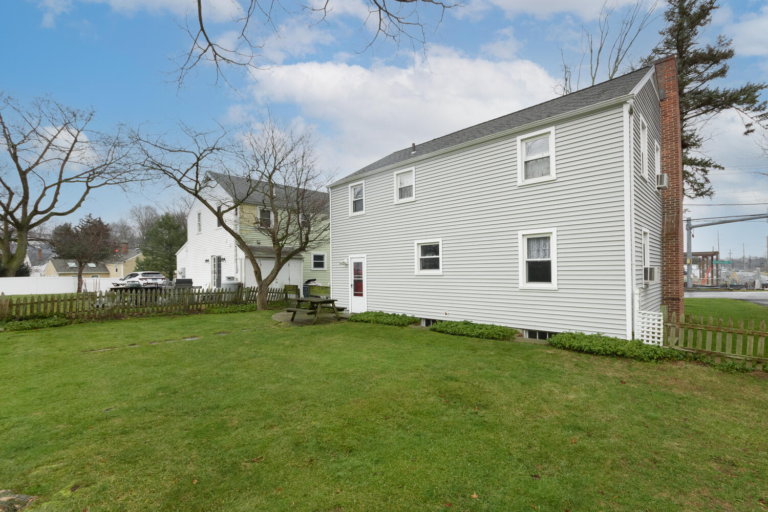 159 Hollow Tree Ridge Road Darien, CT 06820 - Photo 16 of 20 a view of a backyard of house with green space