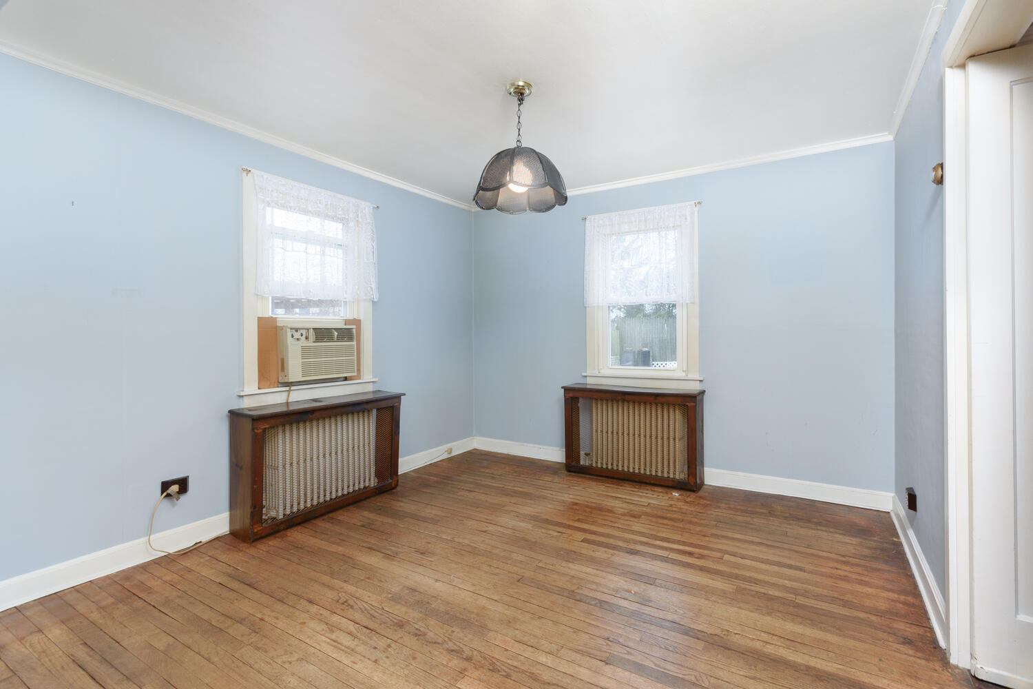 159 Hollow Tree Ridge Road Darien, CT 06820 - Photo 5 of 20 a view of an empty room with wooden floor and a window