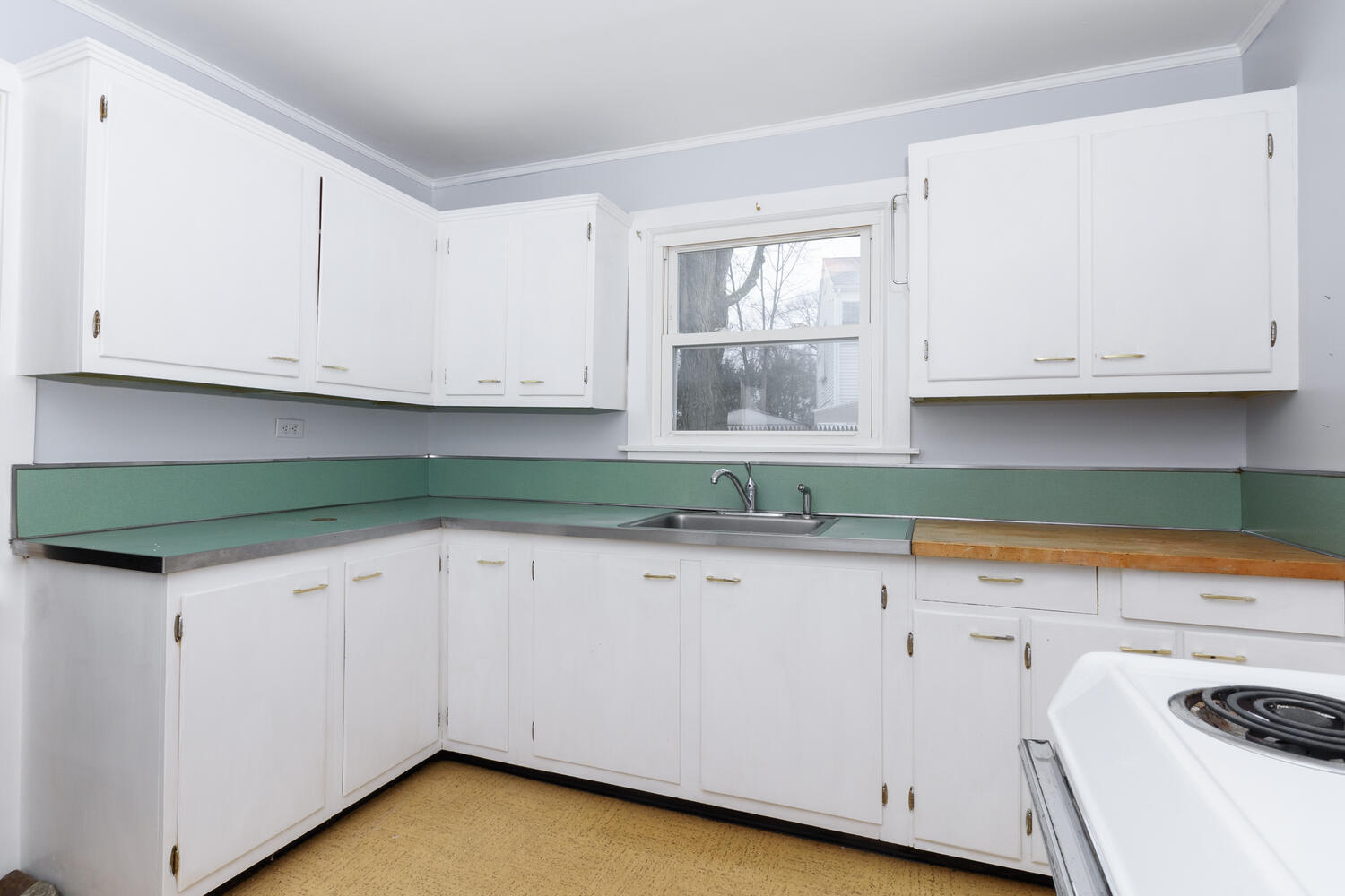 159 Hollow Tree Ridge Road Darien, CT 06820 - Photo 7 of 20 a kitchen with granite countertop white cabinets and sink