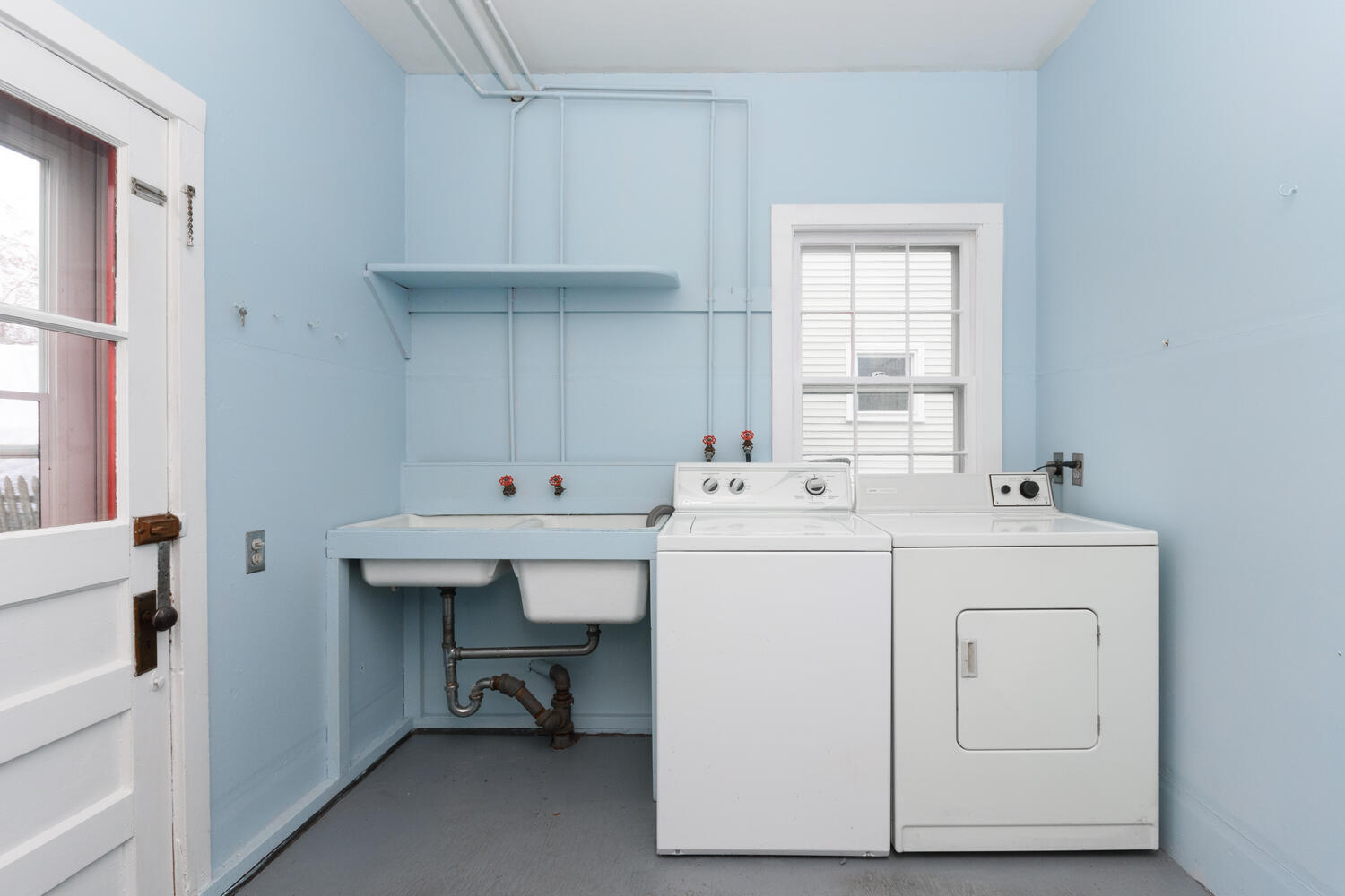 159 Hollow Tree Ridge Road Darien, CT 06820 - Photo 9 of 20 a utility room with cabinets dryer and washer