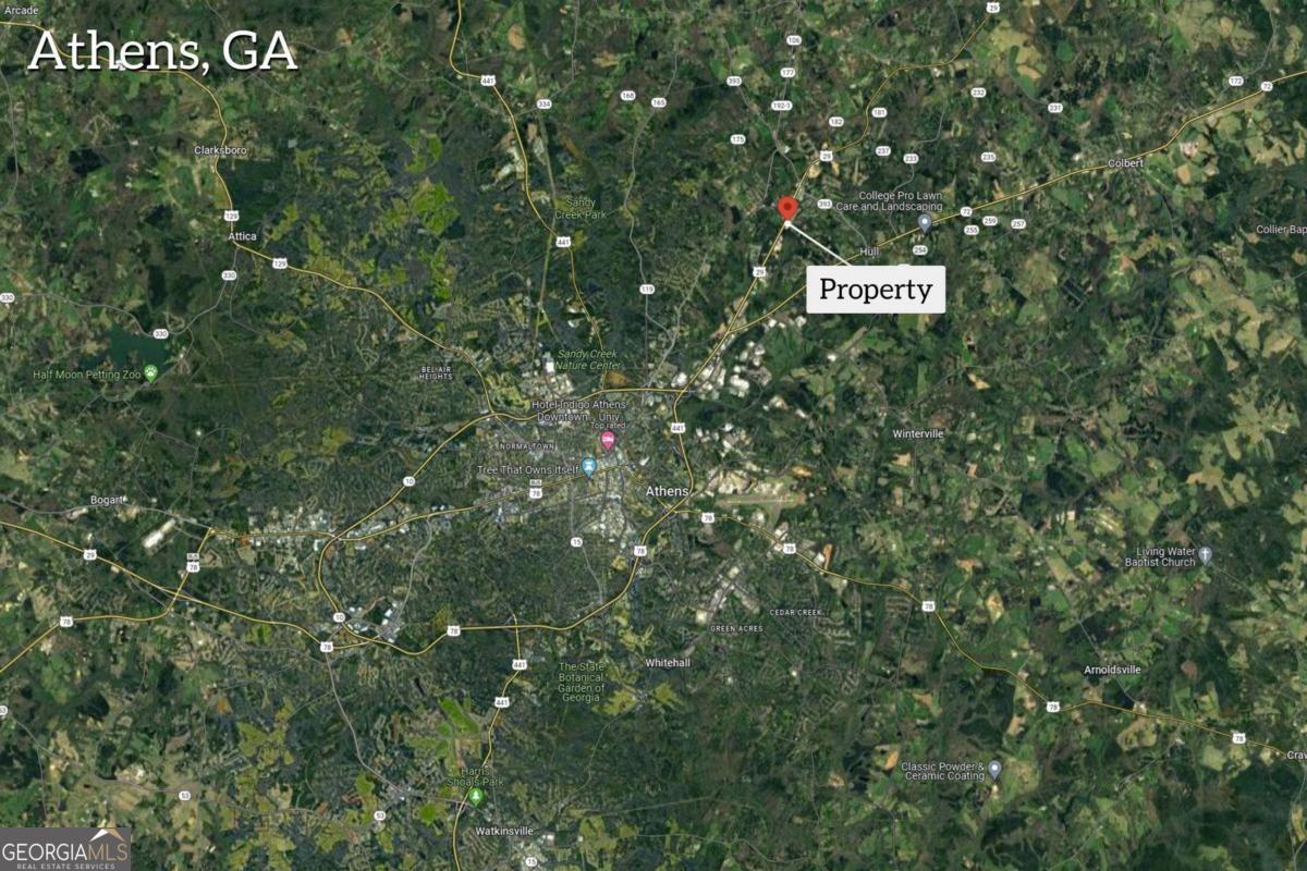 540-542 Harve Mathis Road Athens, GA 30646 - Photo 2 of 15 a sign that is sitting in front of a tree