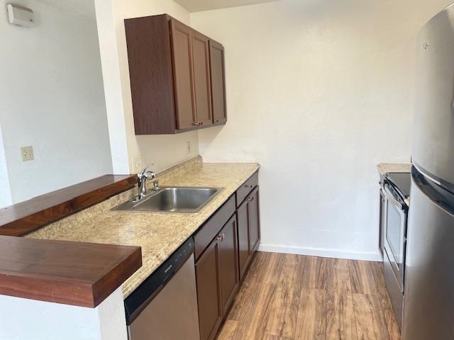140 Uwapo Road, Unit 4204 Kihei, HI 96753 - Photo 3 of 12 a bathroom with a granite countertop sink and a mirror
