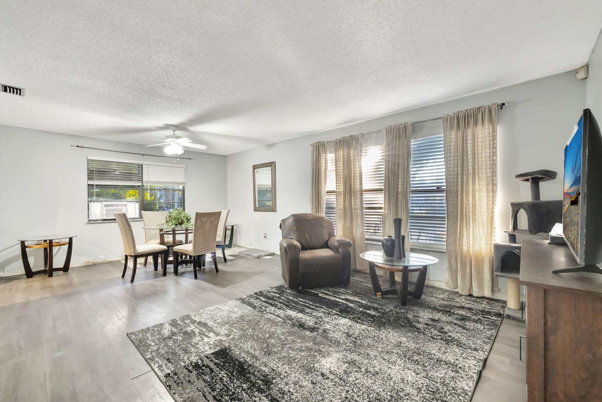 2080 Colonial Road, Unit 1 Fort Pierce, FL 34950 - Photo 11 of 21 a living room with furniture and a table