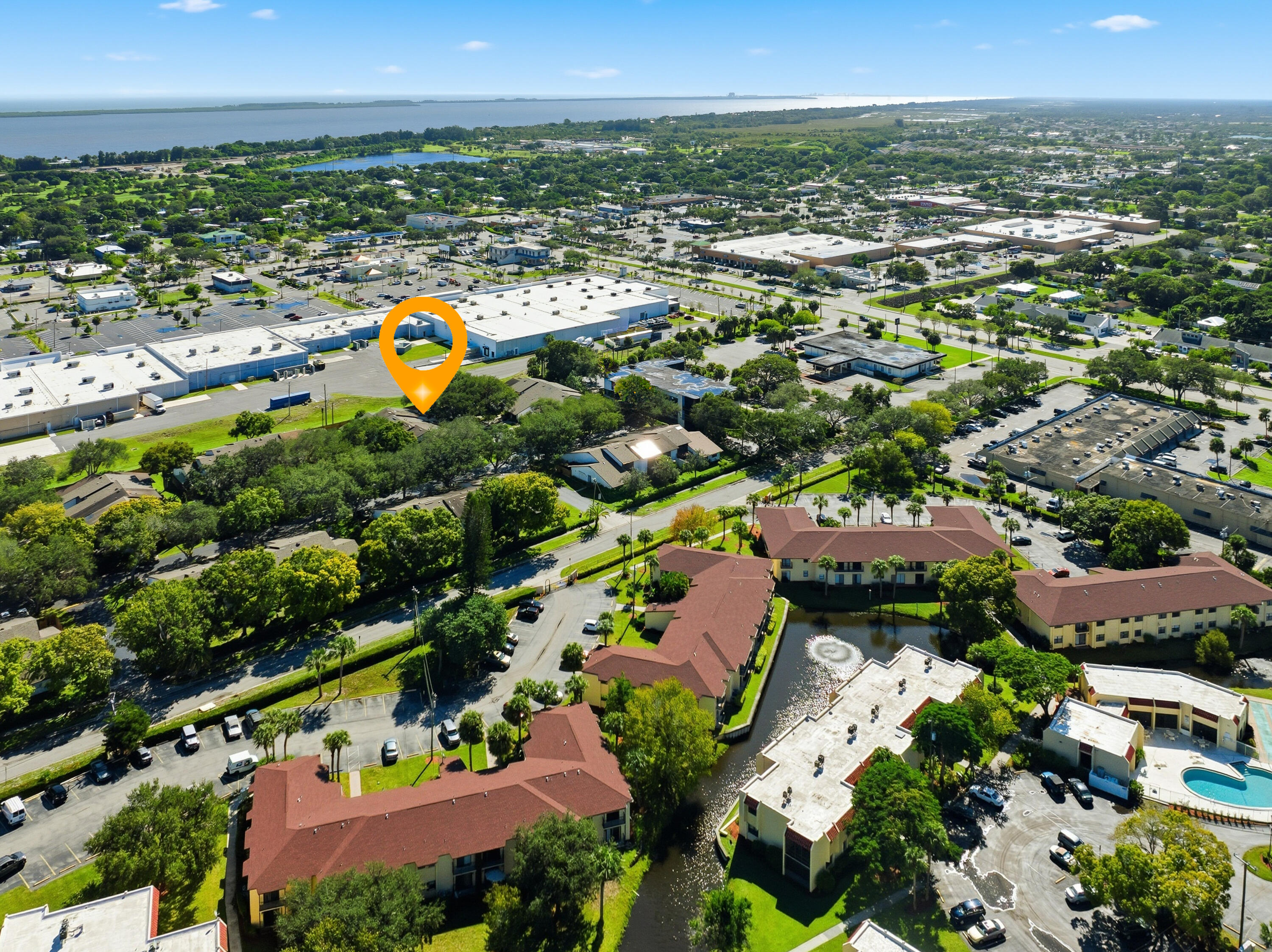 2080 Colonial Road, Unit 1 Fort Pierce, FL 34950 - Photo 20 of 21 an aerial view of a houses with a swimming pool