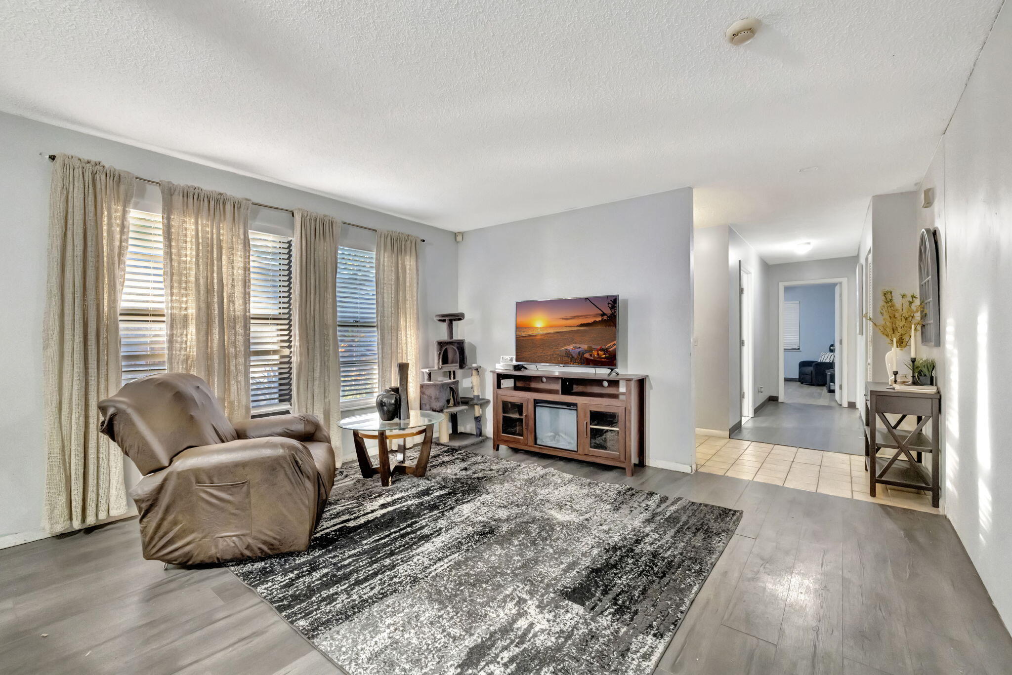 2080 Colonial Road, Unit 1 Fort Pierce, FL 34950 - Photo 2 of 21 a living room with furniture and a flat screen tv