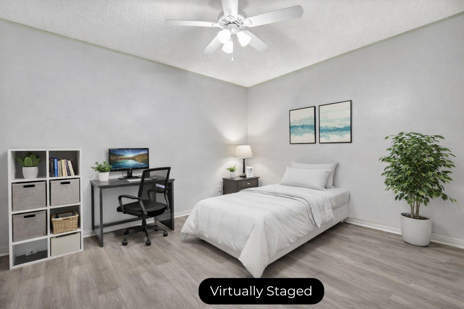 2080 Colonial Road, Unit 1 Fort Pierce, FL 34950 - Photo 5 of 21 a bedroom with a bed and a chandelier