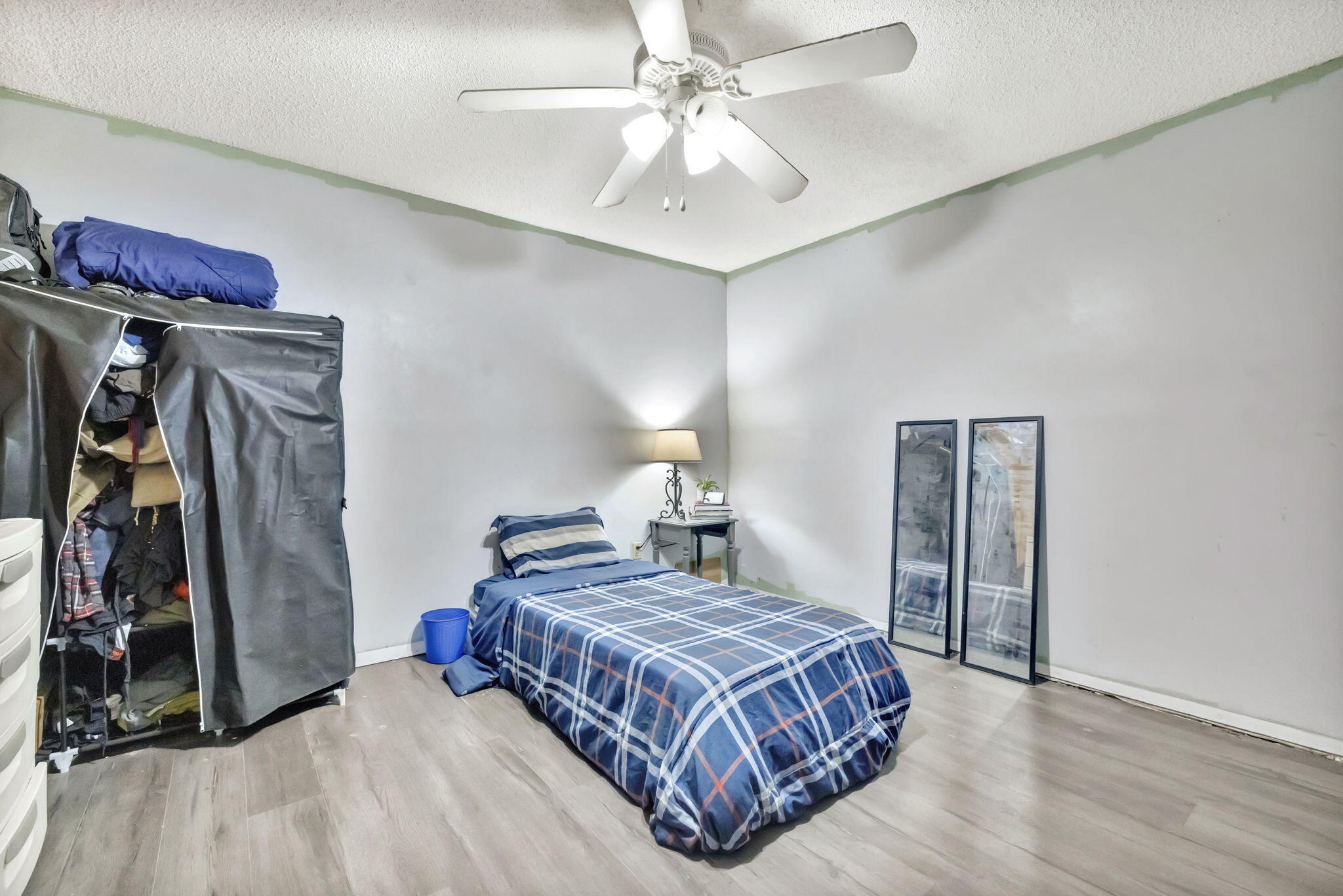 2080 Colonial Road, Unit 1 Fort Pierce, FL 34950 - Photo 6 of 21 a bedroom with a bed and a walk in closet