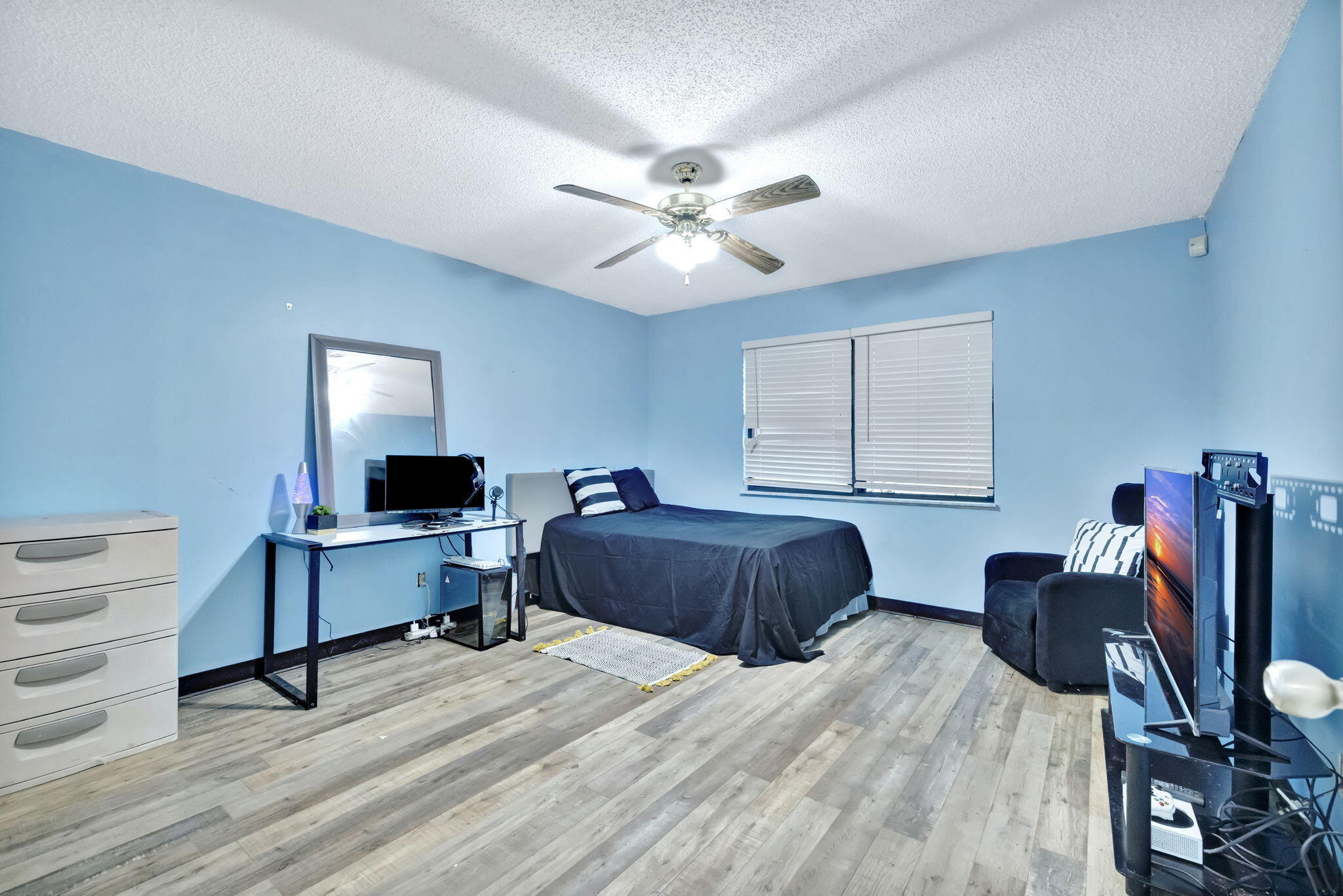 2080 Colonial Road, Unit 1 Fort Pierce, FL 34950 - Photo 7 of 21 a bedroom with a bed window and a desk
