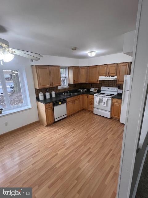 15 Noble Road Sicklerville, NJ 08081 - Photo 11 of 21 a kitchen with stainless steel appliances wooden floors and wooden cabinets