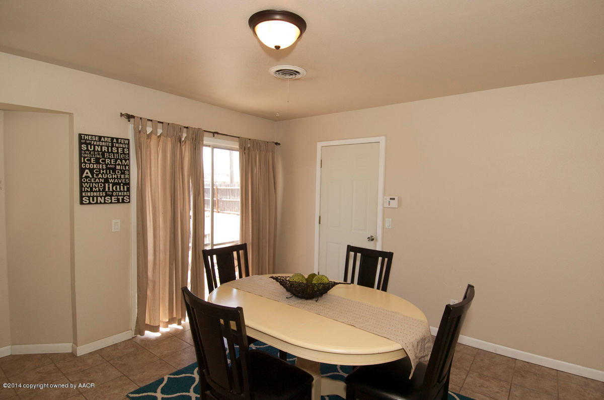 2607 Darrell Avenue Amarillo, TX 79110 - Photo 12 of 28 a view of a dining room with furniture and window