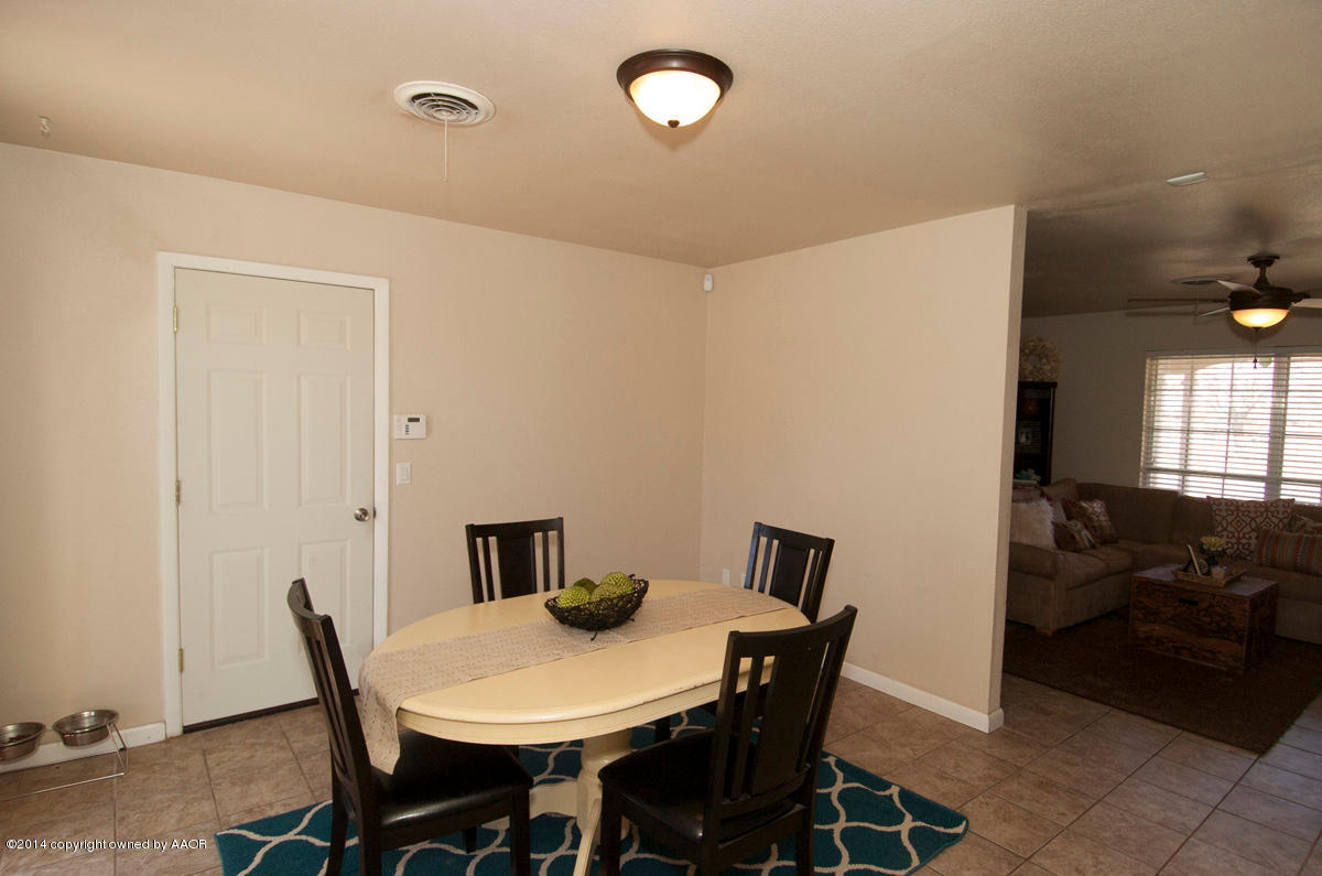 2607 Darrell Avenue Amarillo, TX 79110 - Photo 13 of 28 a view of a dining room with furniture
