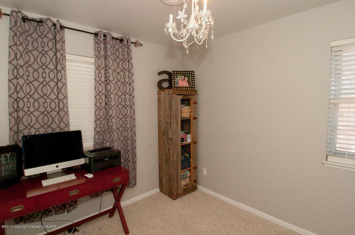 2607 Darrell Avenue Amarillo, TX 79110 - Photo 23 of 28 a view of a workspace with furniture and a window
