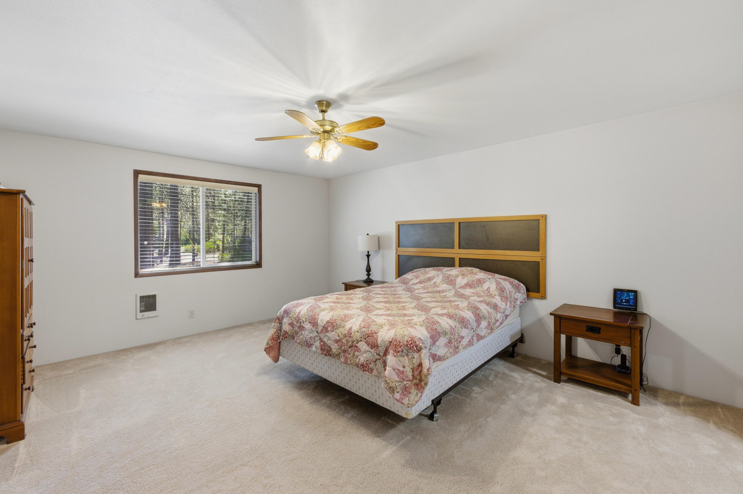 50868 Doe Loop La Pine, OR 97739 - Photo 28 of 51 a bedroom with a bed and a chandelier