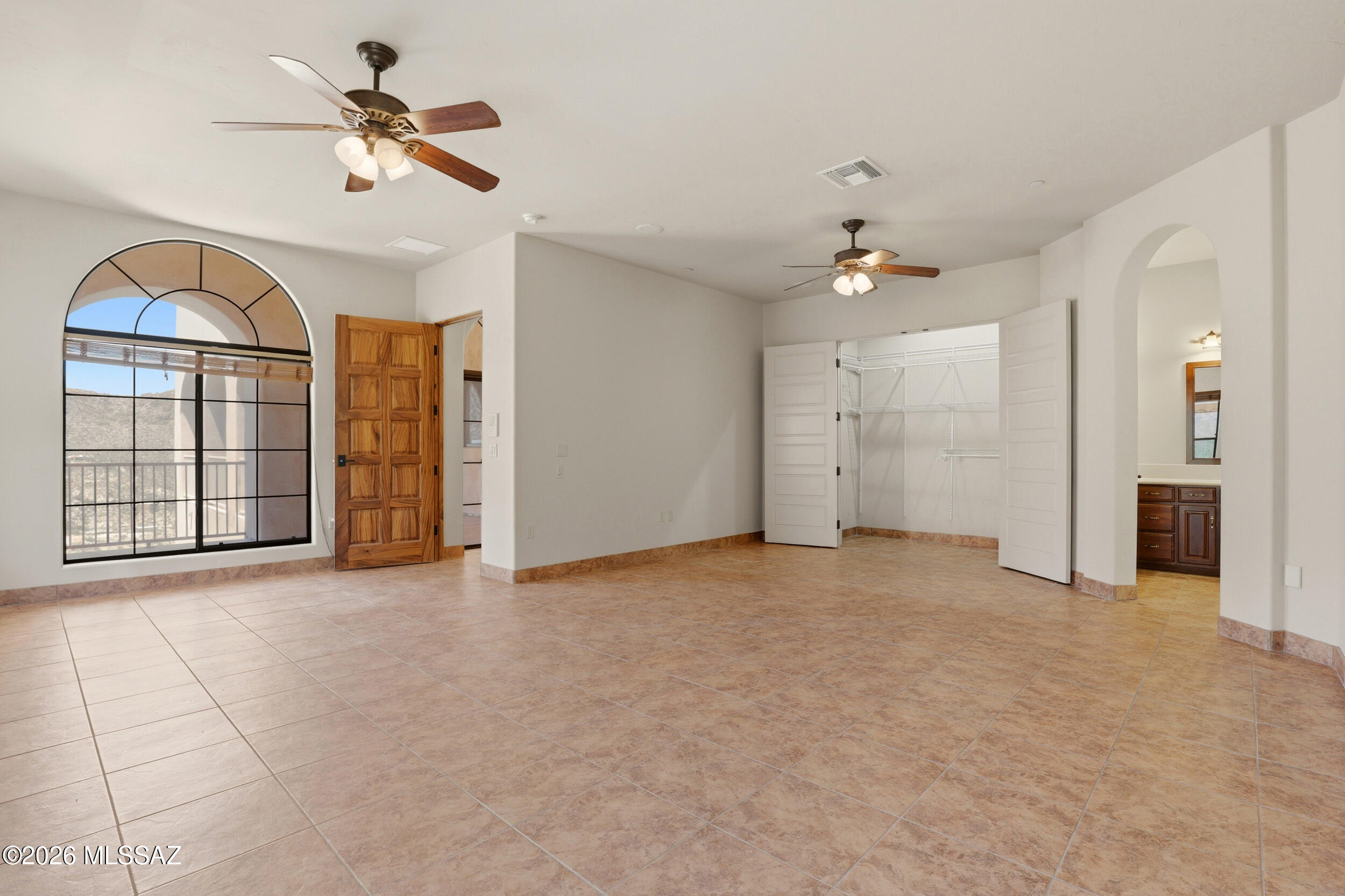 6331 West Trails End Road Tucson, AZ 85745 - Photo 12 of 41 a view of an empty room with a window