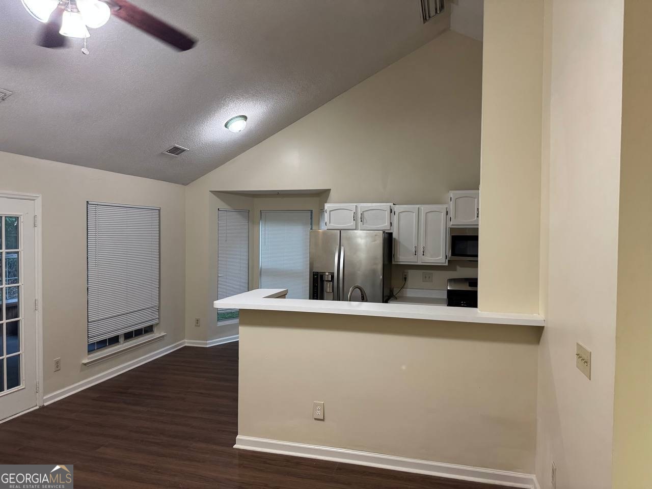 3821 Rex Mill Square Rex, GA 30273 - Photo 26 of 51 a kitchen with stainless steel appliances a refrigerator and a stove