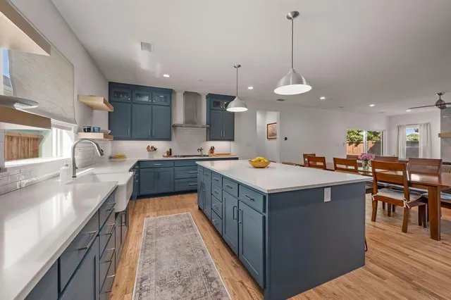 a kitchen that has a lot of cabinets in it