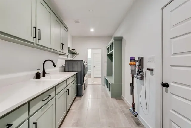 a spacious bathroom with a sink and mirror