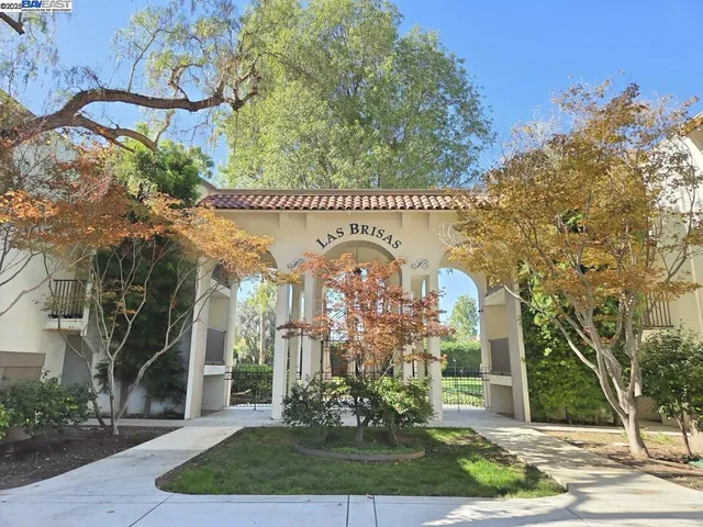 a large building with a tree in front of it