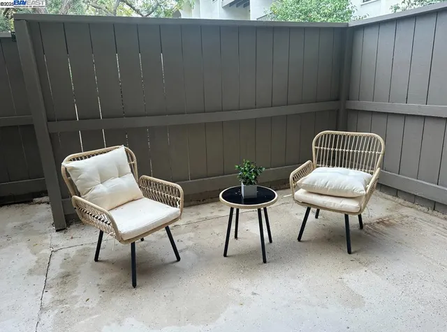 a couple of chairs that are sitting in the backyard