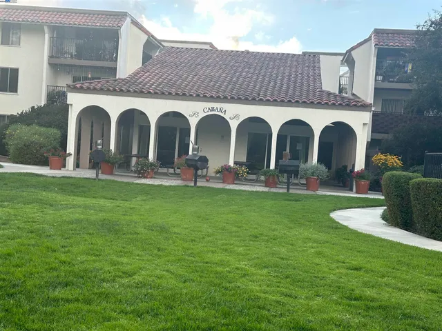 a view of a swimming pool with a patio
