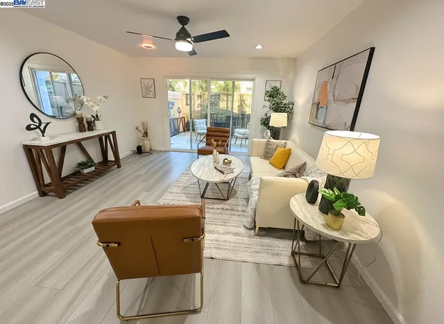 a living room with furniture a rug and a window
