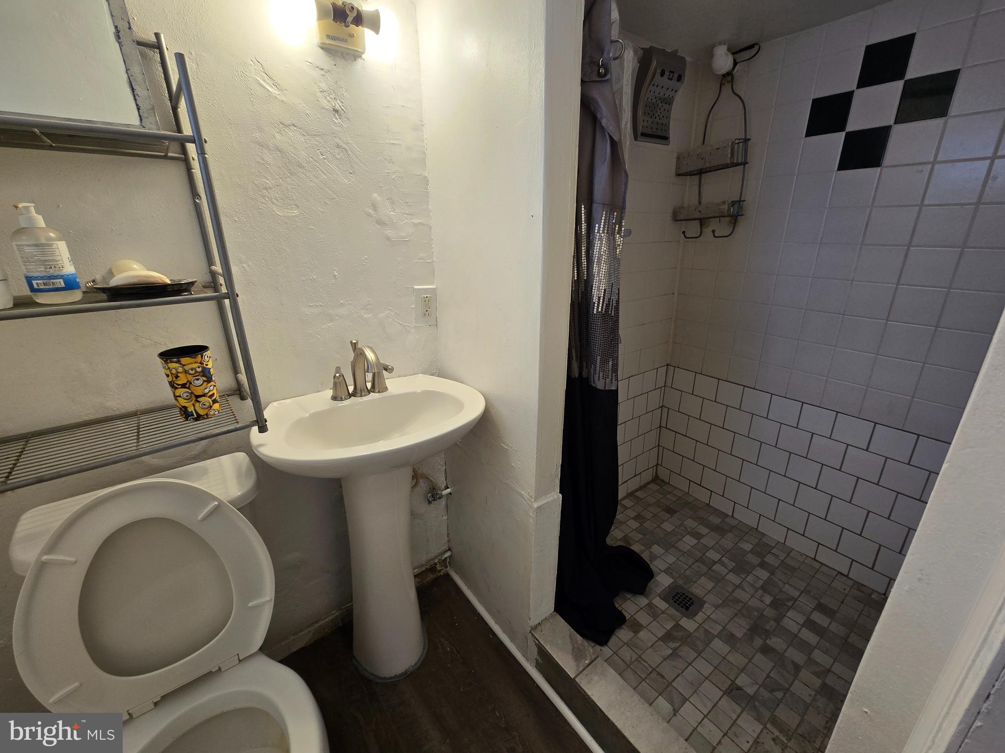 201 St Laurence Road Upper Darby, PA 19082 - Photo 24 of 37 a bathroom with a sink and a toilet
