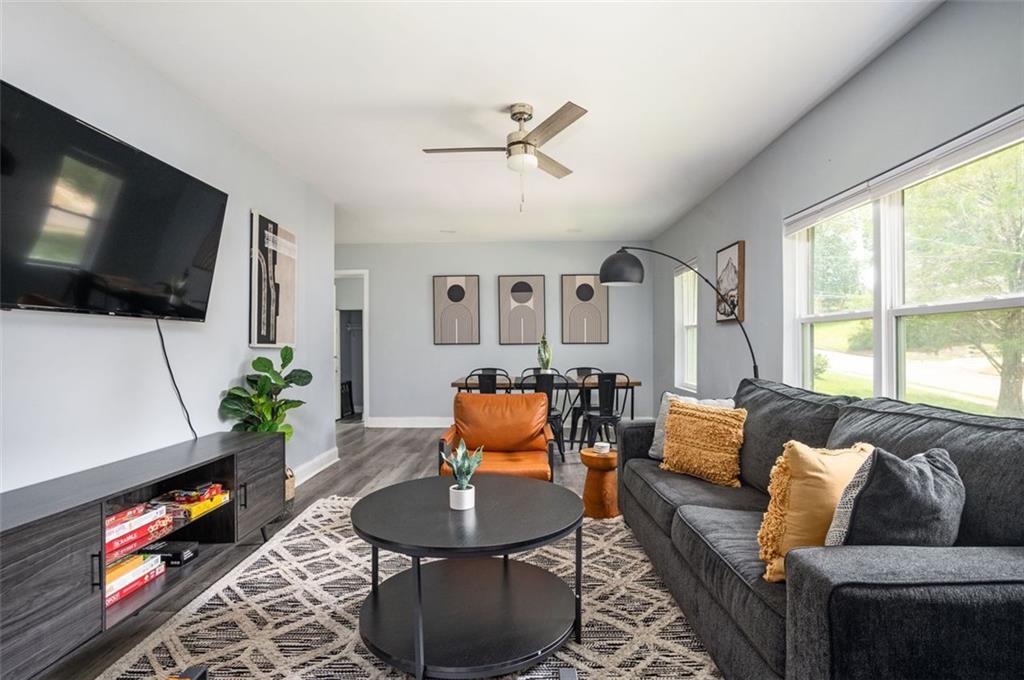 1778 Flintwood Drive Southeast Atlanta, GA 30316 - Photo 1 of 30 a living room with furniture a flat screen tv and a window