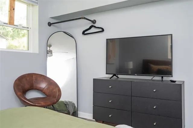 a room with furniture and flat screen tv