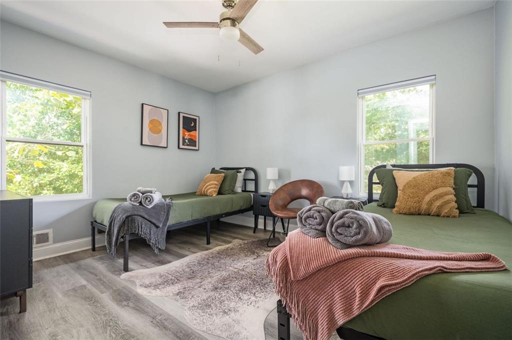 1778 Flintwood Drive Southeast Atlanta, GA 30316 - Photo 17 of 30 a bedroom with two beds and a large window