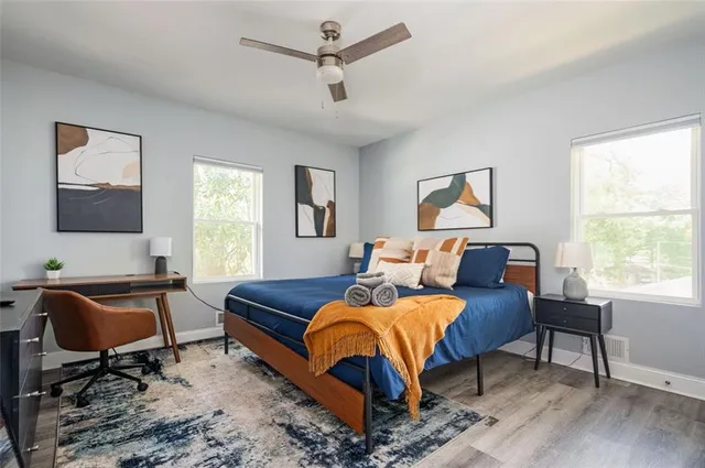 a bedroom with furniture and a window