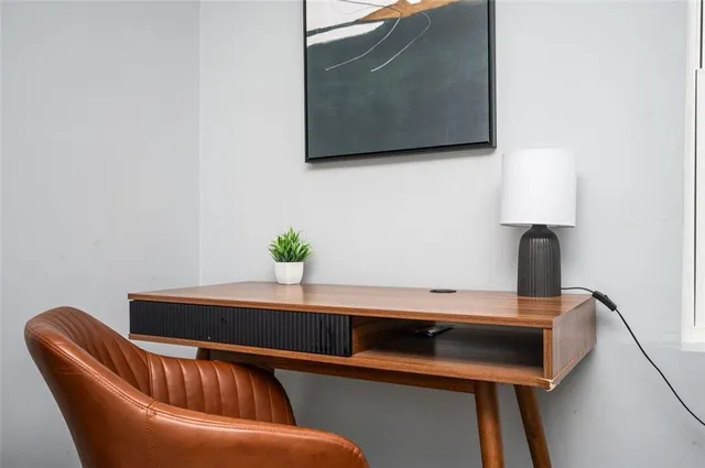 a blue chair sitting next to a sink