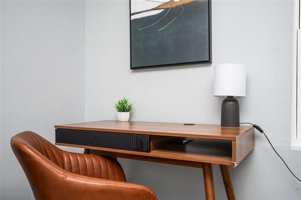 1778 Flintwood Drive Southeast Atlanta, GA 30316 - Photo 24 of 30 a blue chair sitting next to a sink