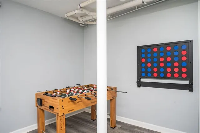 a view of a room with a table and chairs