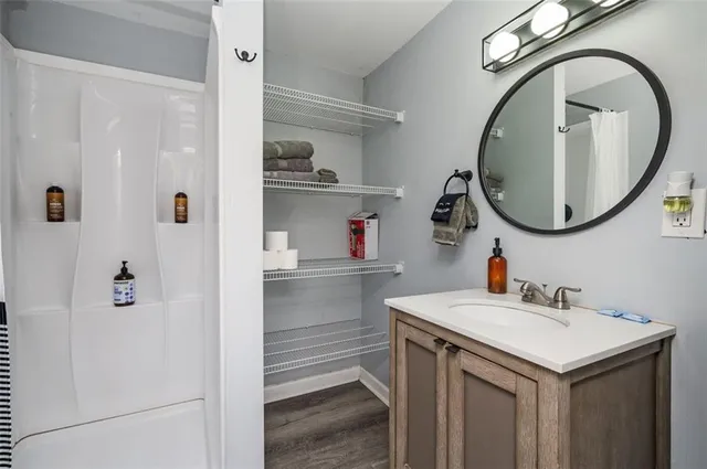 a bathroom with a sink and a mirror