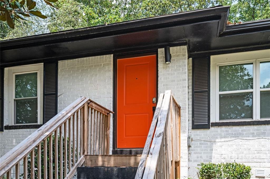 1778 Flintwood Drive Southeast Atlanta, GA 30316 - Photo 29 of 30 a view of deck with a large window and wooden floor