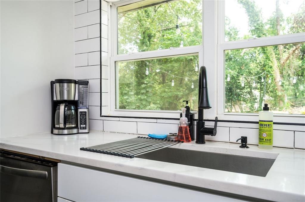 1778 Flintwood Drive Southeast Atlanta, GA 30316 - Photo 6 of 30 a kitchen with a sink and large window