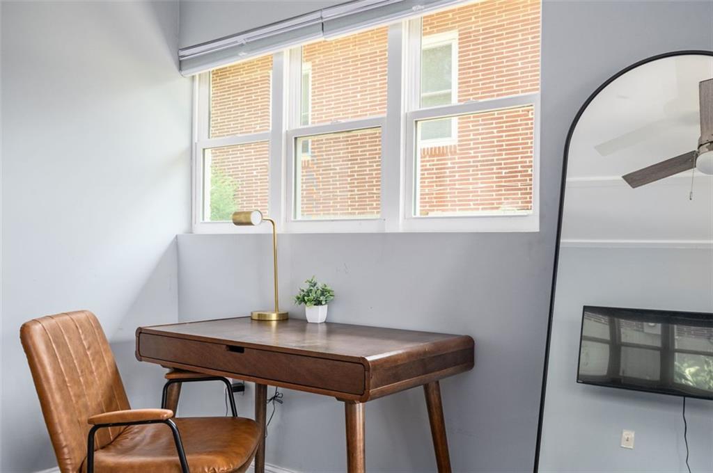 1778 Flintwood Drive Southeast Atlanta, GA 30316 - Photo 10 of 30 a view of a workspace with furniture and window