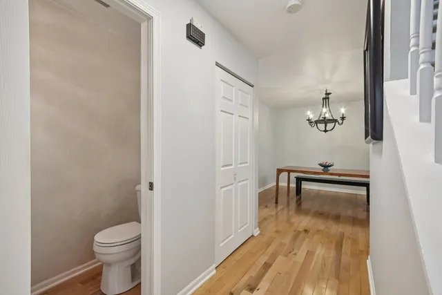 a white toilet sitting next to a bathroom sink