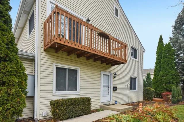 a front view of a house with a garage