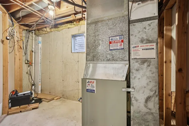 a view of a shower and a table in a bathroom