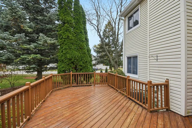 a view of deck with wooden floor and fence