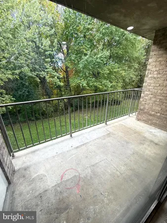 a view of balcony and trees